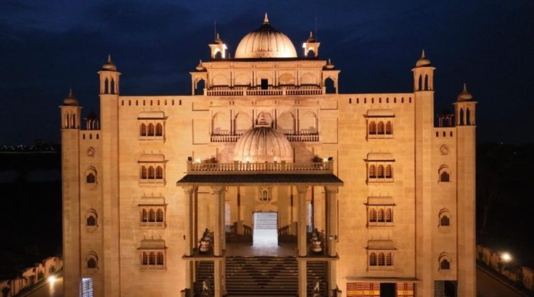 Illuminated heritage stone façade at night